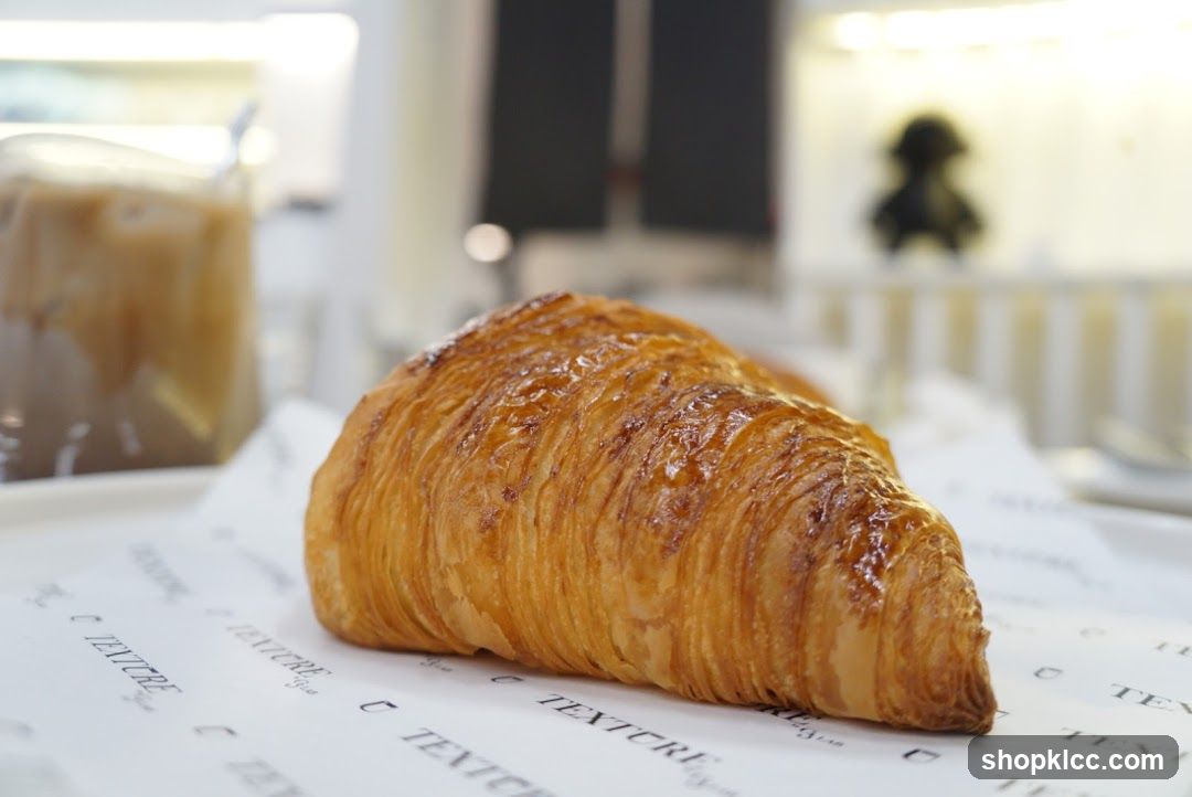 Croissant on printed paper
