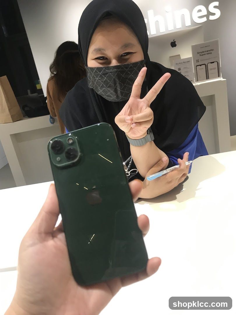 Person holding iPhone in store