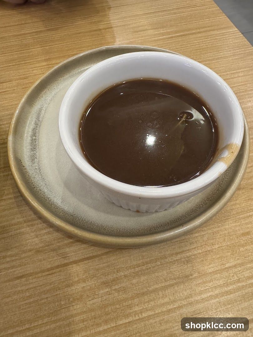 Bowl of Dark Soup or Broth