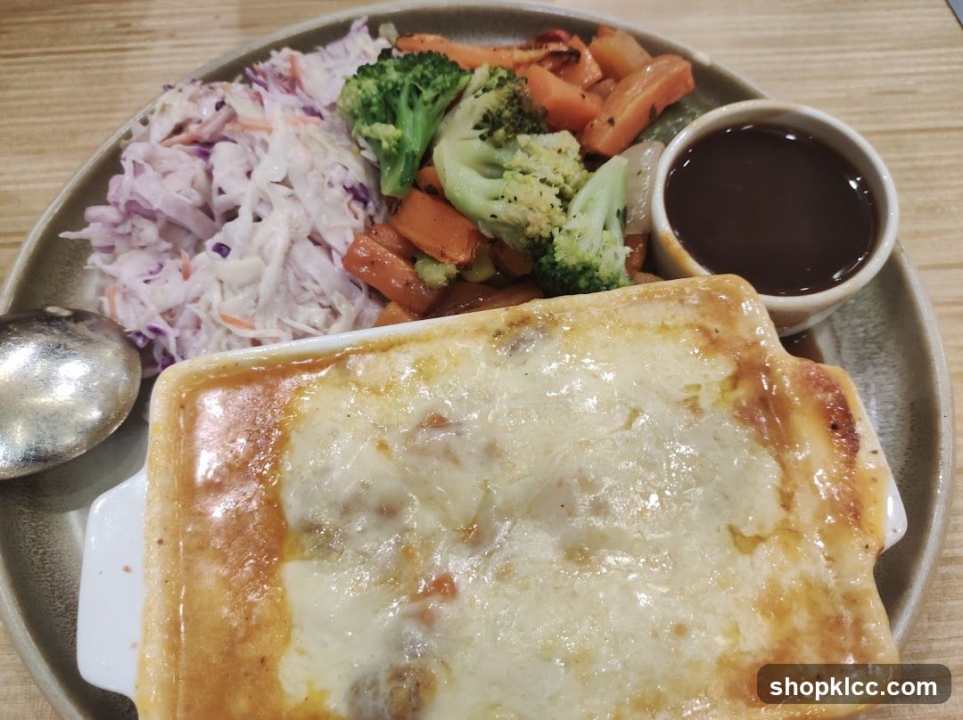 Baked Dish with Side Salad and Sauce