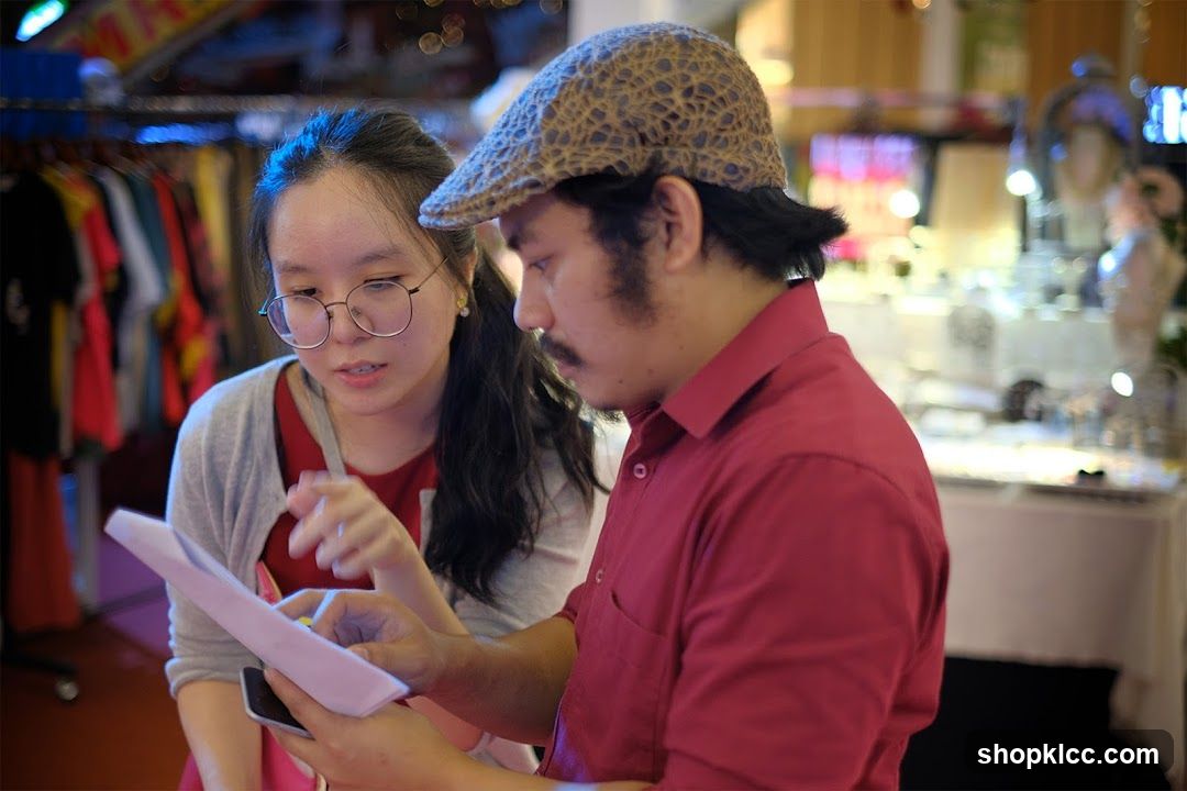 Two people reviewing documents in a shop