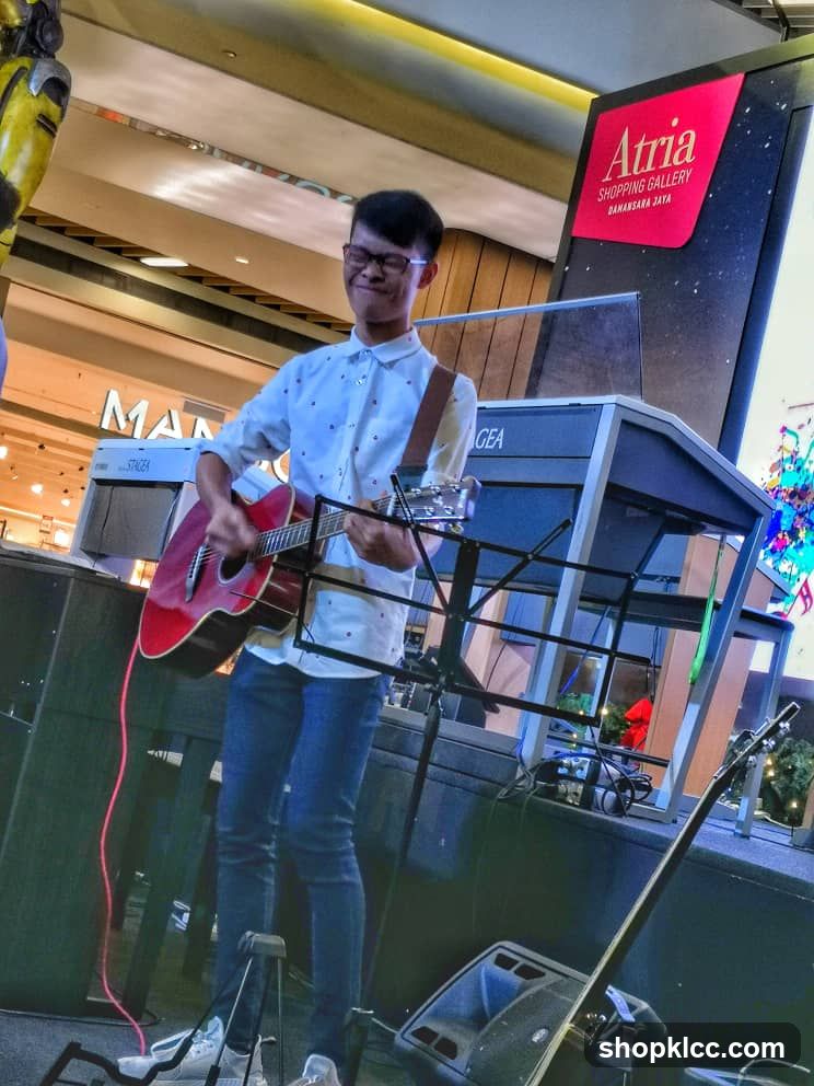 Guitarist performing in shopping mall