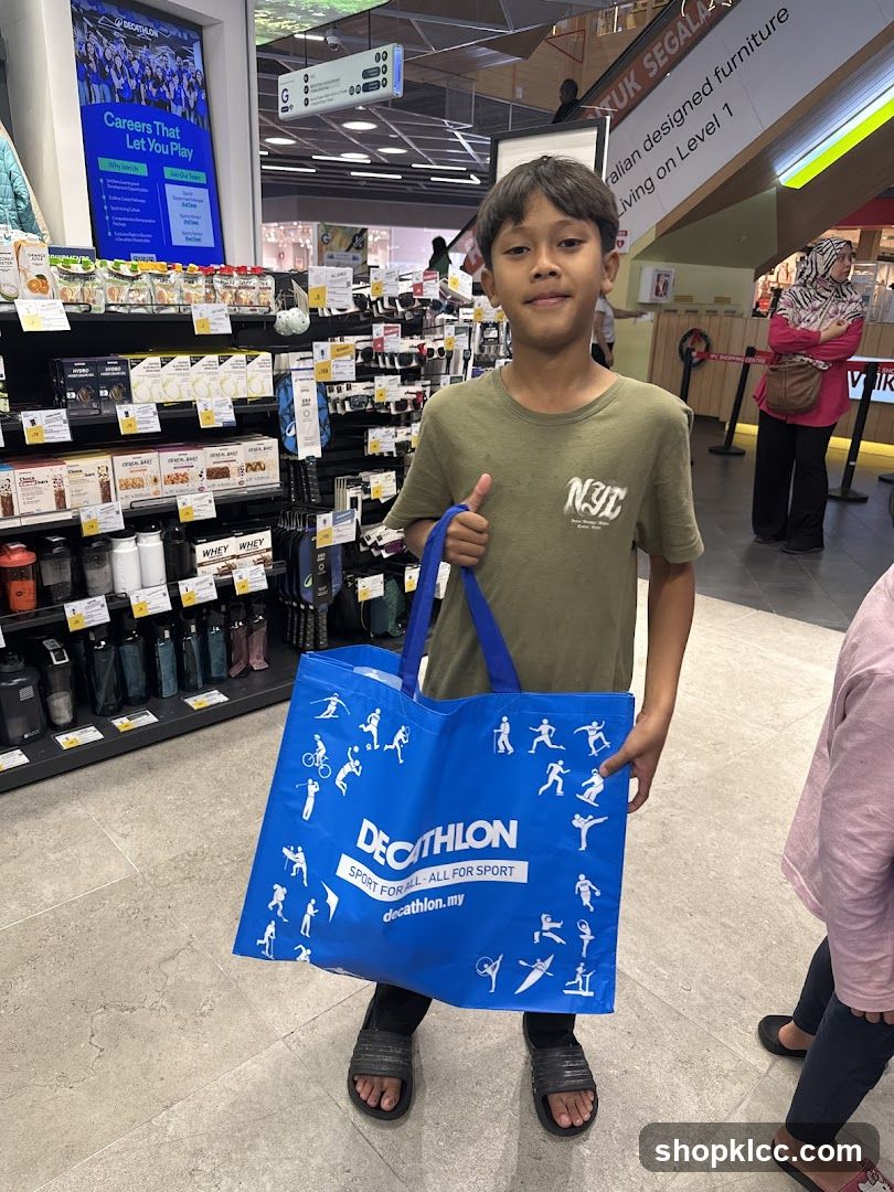 Boy holding Decathlon bag in store