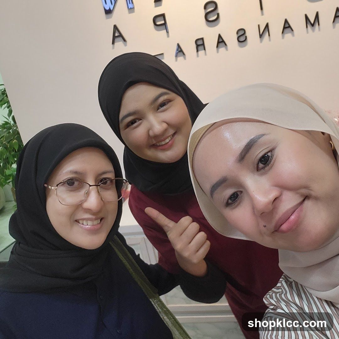 Three women in hijab posing indoors