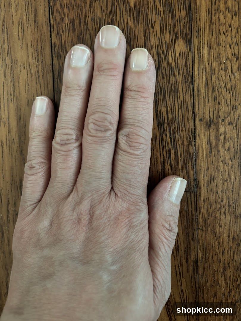 Hand on wooden surface