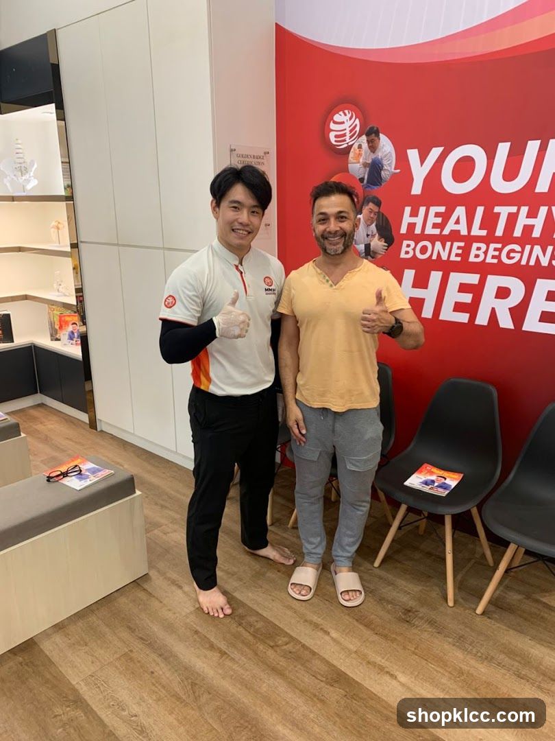 Two men giving thumbs up in a clinic or wellness center