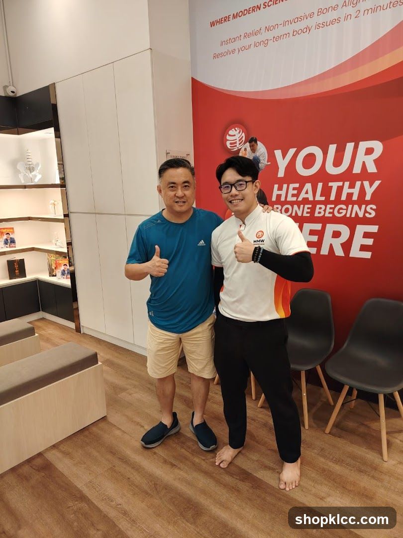 Two men giving thumbs up in a clinic interior