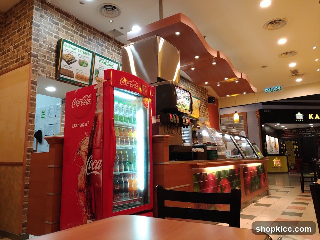 Cafe Interior with Coca-Cola Fridge and Menu Boards