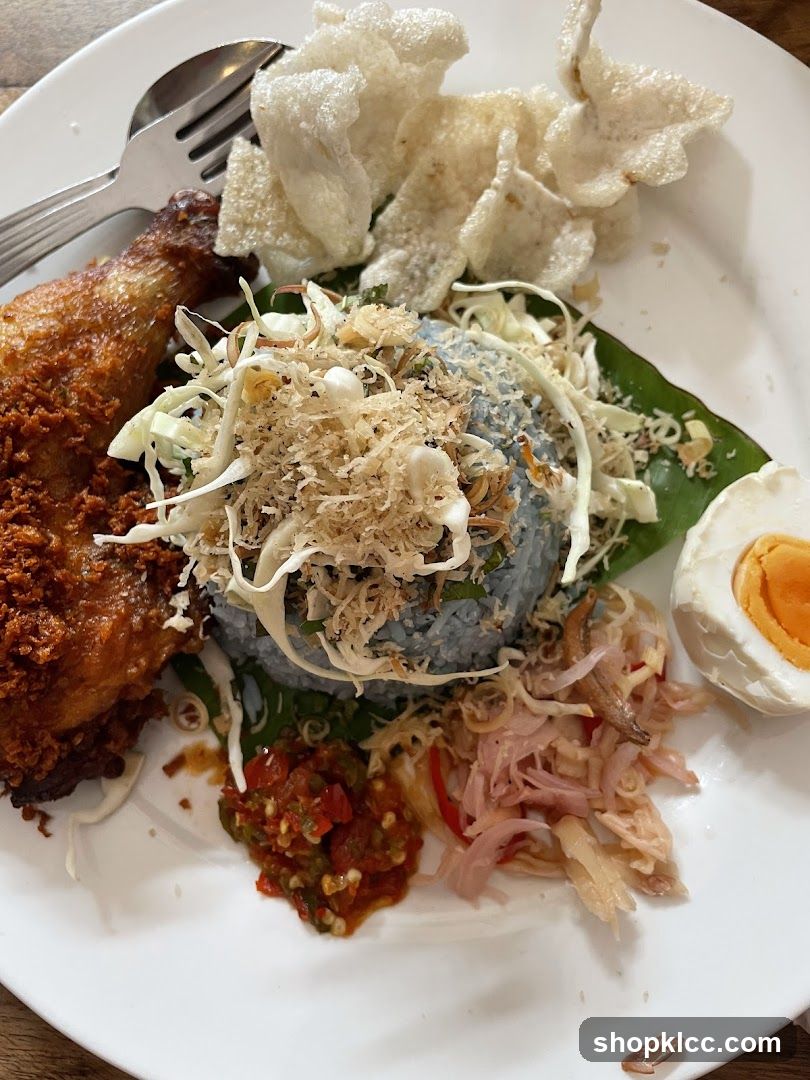 Plate of Fried Chicken with Rice and Side Dishes