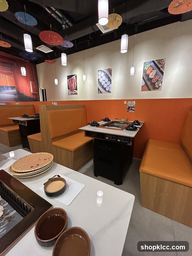 Restaurant Interior with Orange Booths and Decorative Ceiling