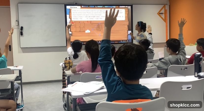 Classroom with students raising hands