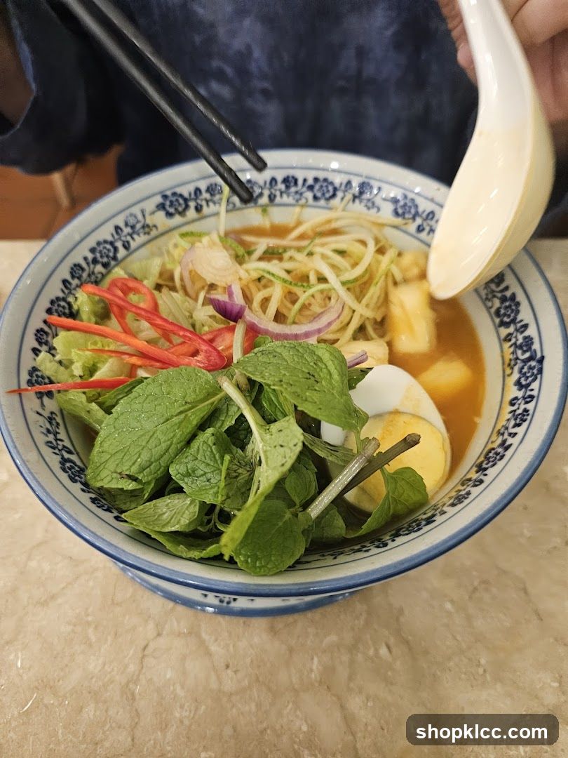 Bowl of Noodle Soup with Fresh Herbs