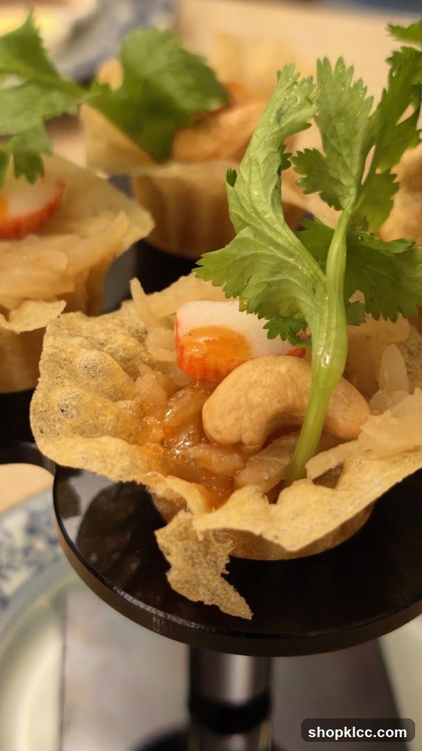 Crispy Shell Appetizer with Cashew and Herb Garnish