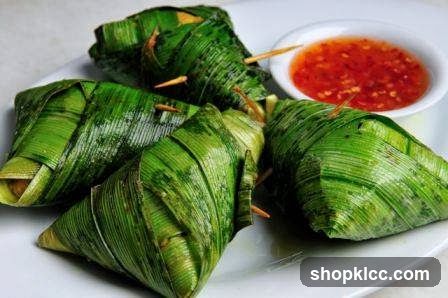 Green Leaf-Wrapped Food with Chili Sauce