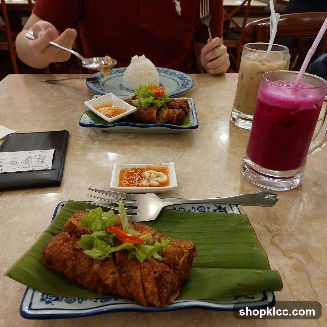 Food Table with Spring Rolls and Drinks
