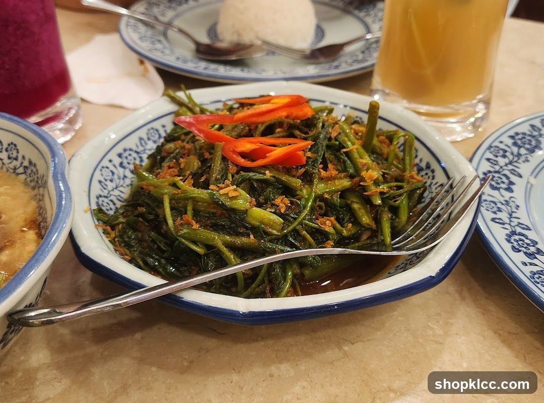 Dish of stir-fried greens with chili peppers