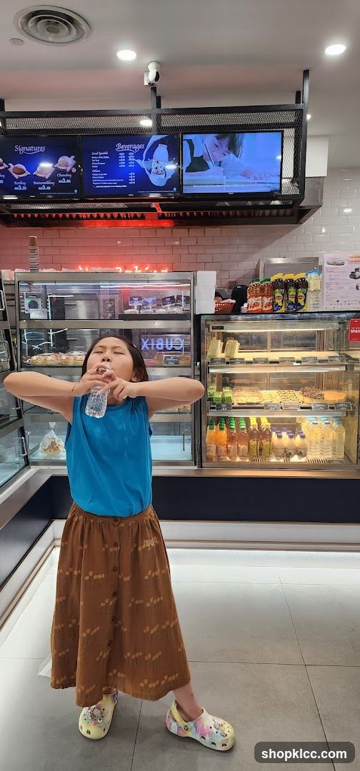 Girl drinking water in a cafe