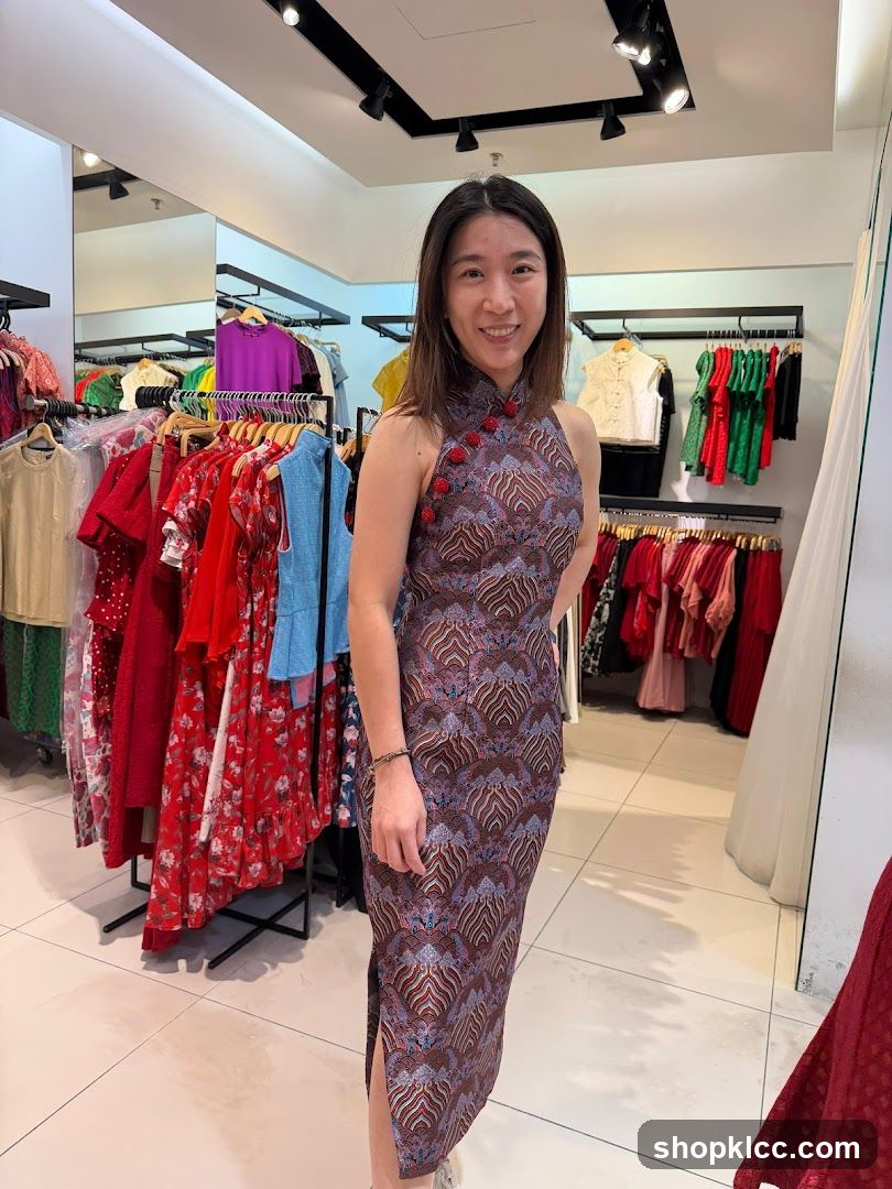 Woman in patterned dress inside clothing store
