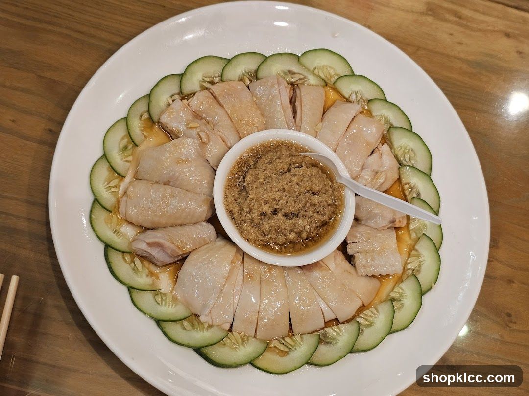 Sliced Chicken with Cucumber Garnish and Sauce