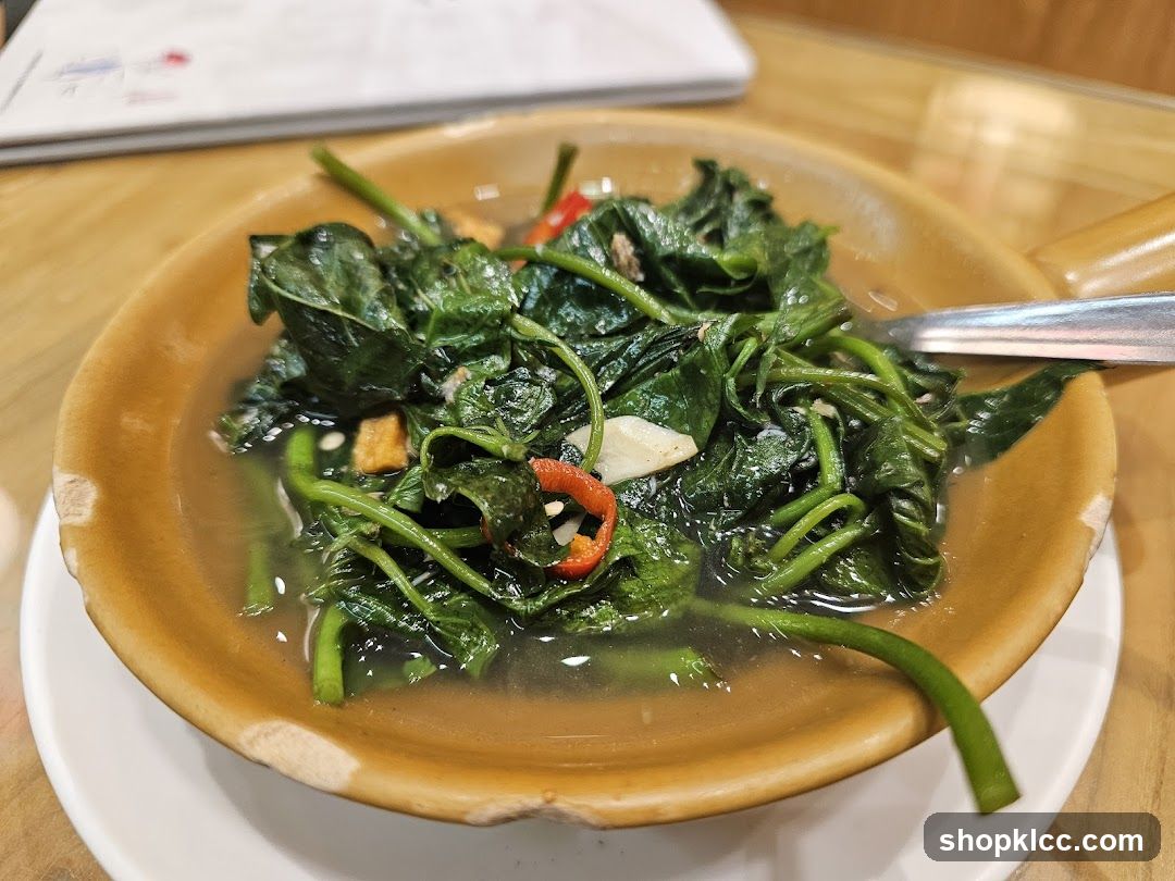 Bowl of stir-fried greens with chili and garlic