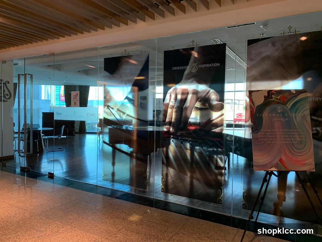 Glass Wall Display with Posters and Easel
