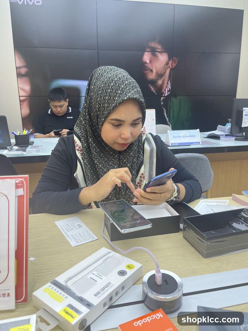 Woman Testing Smartphone in Store