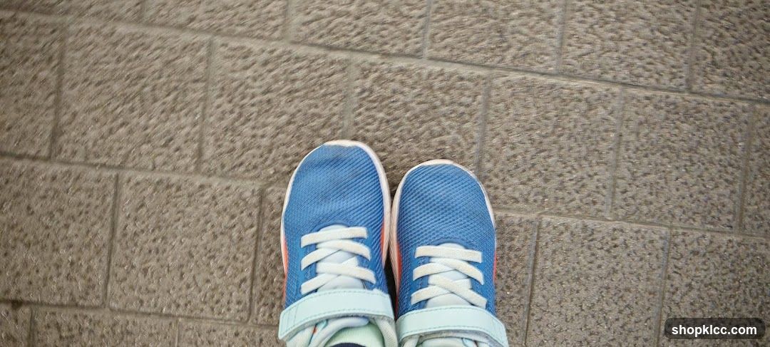 Blue Sneakers on Pavement