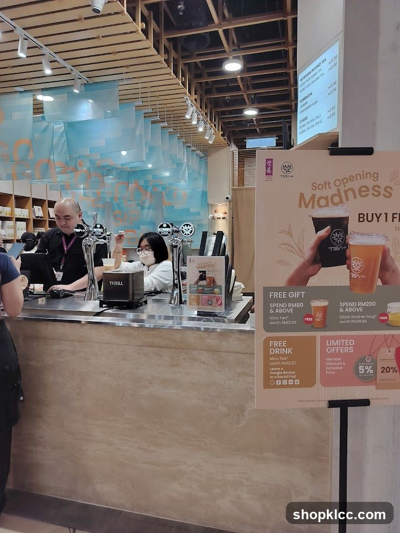 Coffee Shop Interior with Staff and Promotional Signage