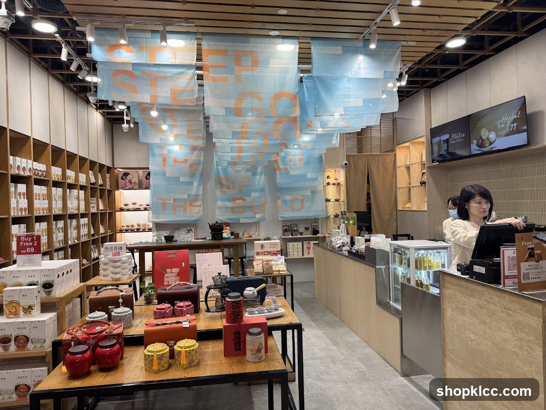 Interior of a tea shop with hanging banners and product displays