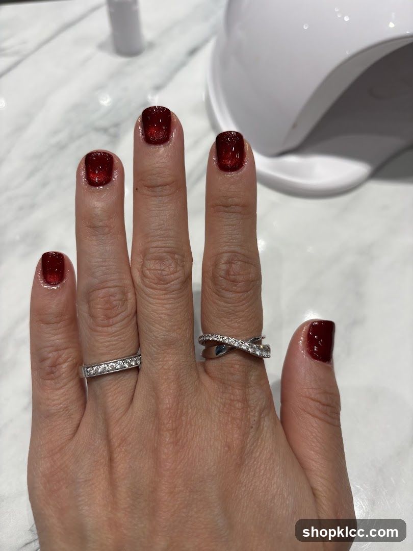 Woman's Hands with Red Nails and Rings
