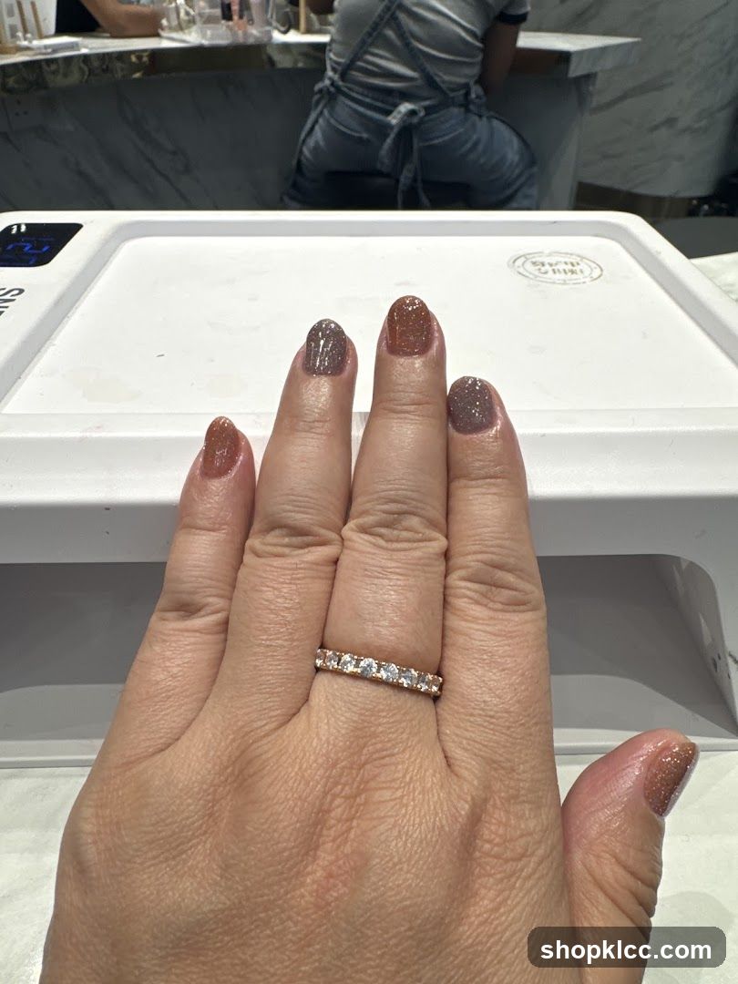 Hand with freshly painted nails