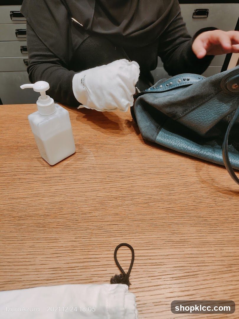 Hand Sanitizer and Bag on Table
