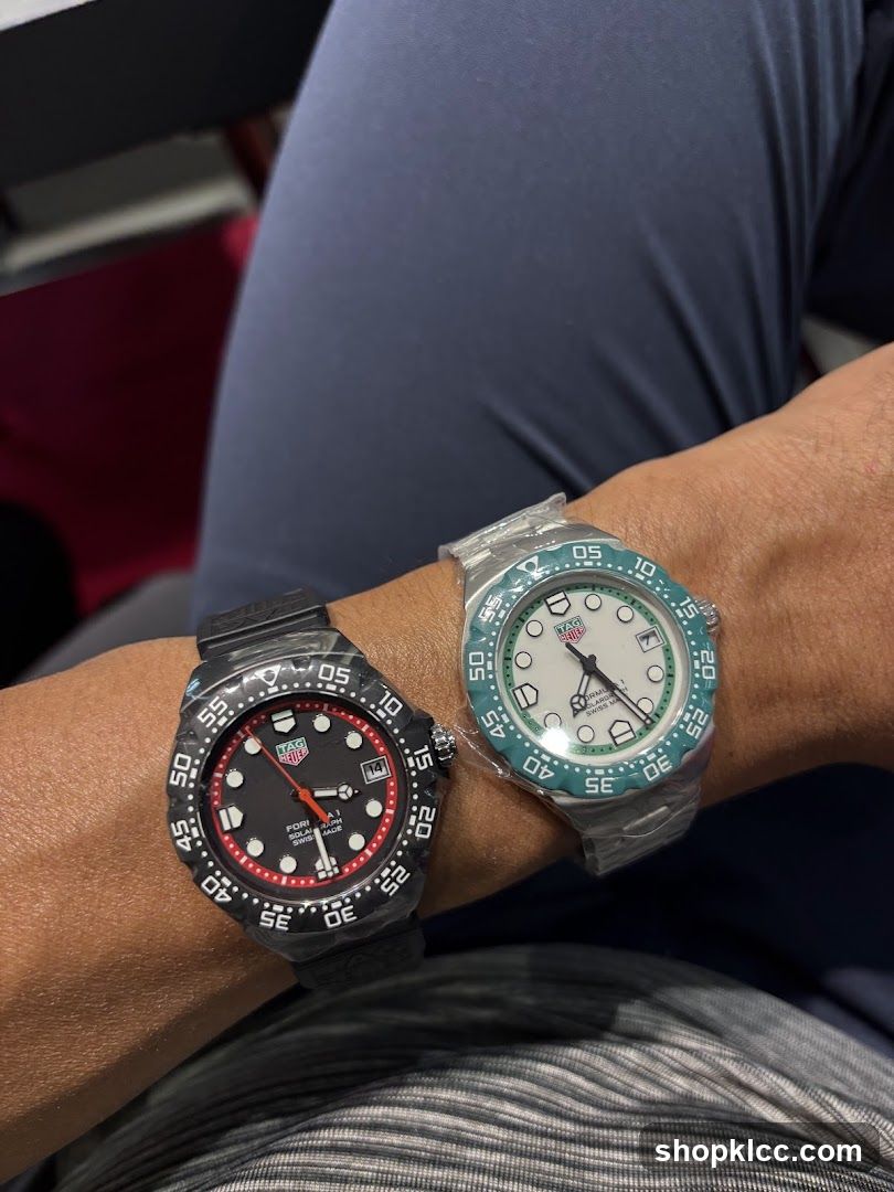 Two Tag Heuer watches on wrist