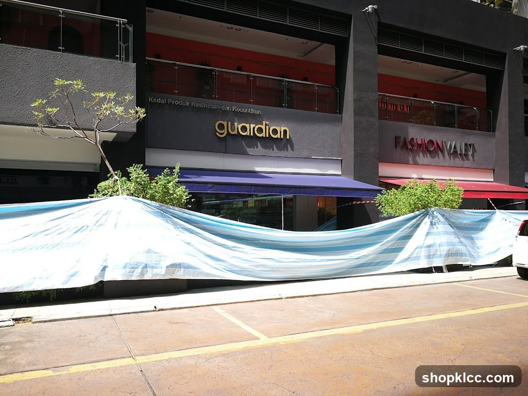Guardian Storefront with Blue Tarp Covering