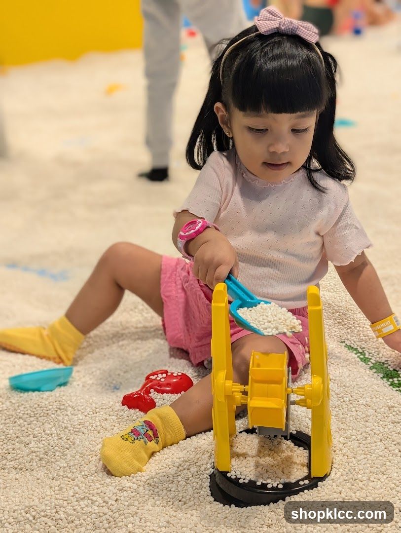 Child Playing with Sand Toys