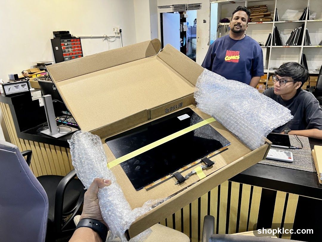Unboxing a Screen in an Office Setting