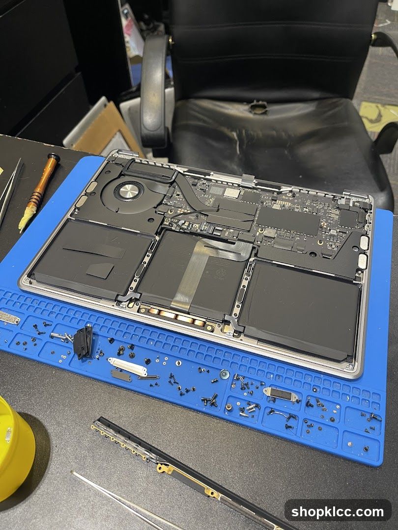 Disassembled Laptop on Workbench