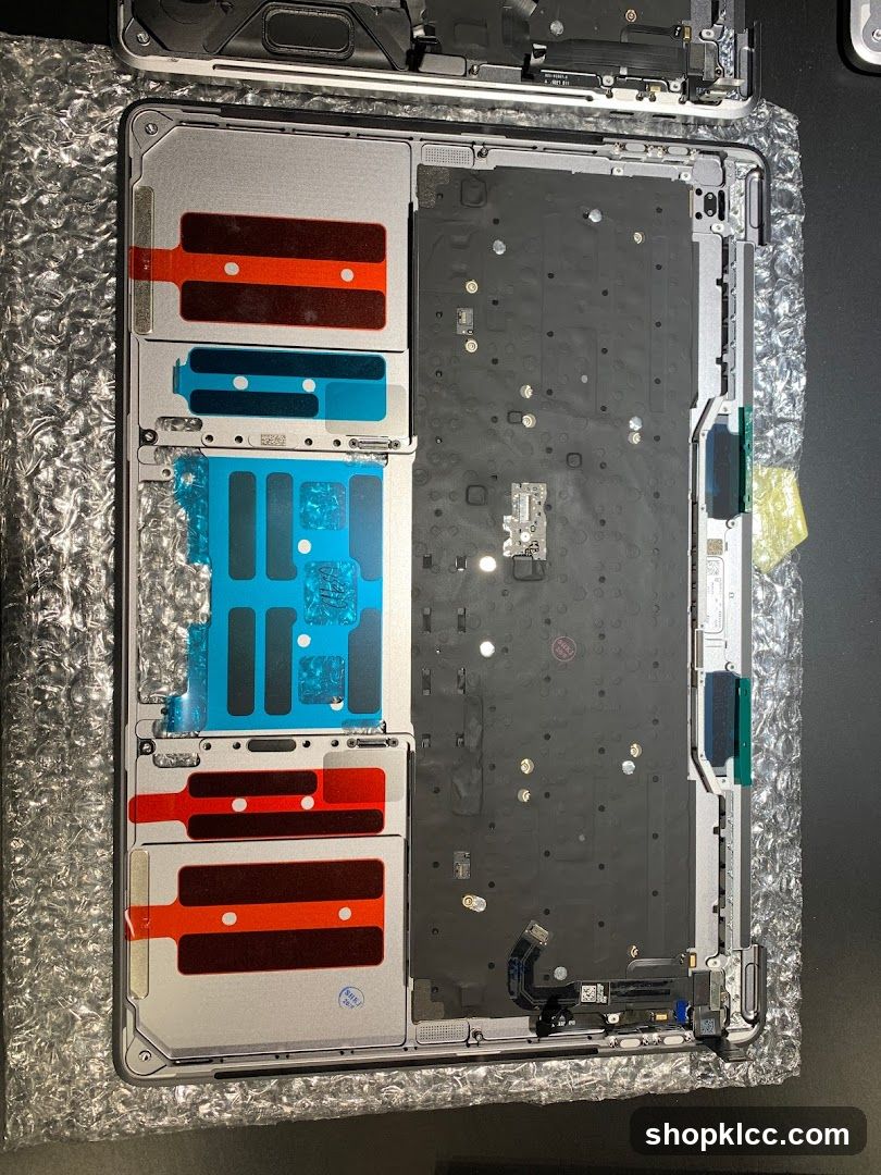 Disassembled Laptop Chassis with Thermal Pads