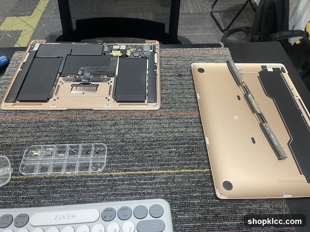 Disassembled Laptop on Desk