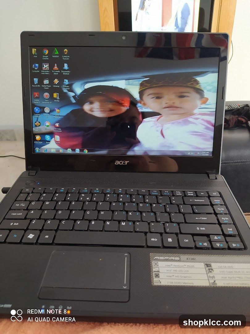 Acer Laptop Displaying Desktop with Photo Wallpaper
