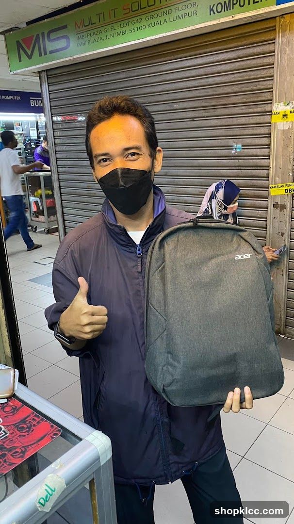 Man with Acer Backpack in Storefront