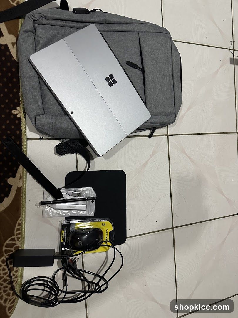 Laptop and Accessories on Floor