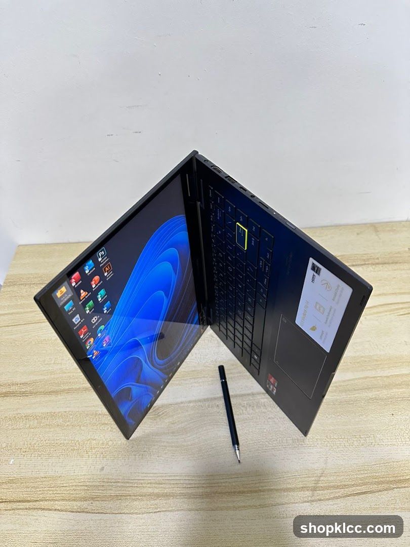 Laptop on table with stylus