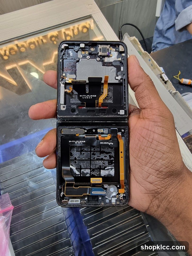 Disassembled Foldable Phone in Hand