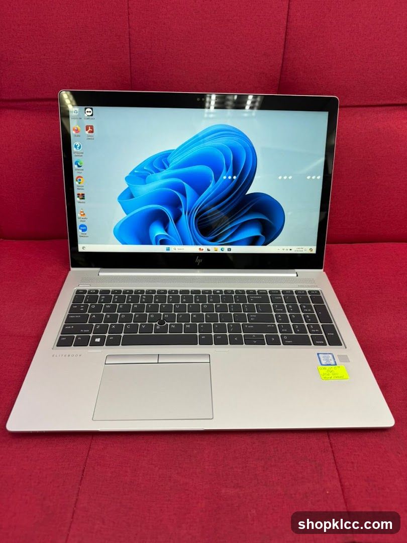 HP EliteBook Laptop on Red Sofa