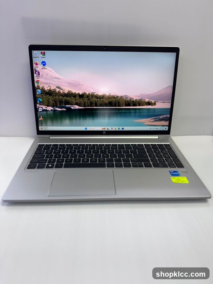HP Laptop on White Surface