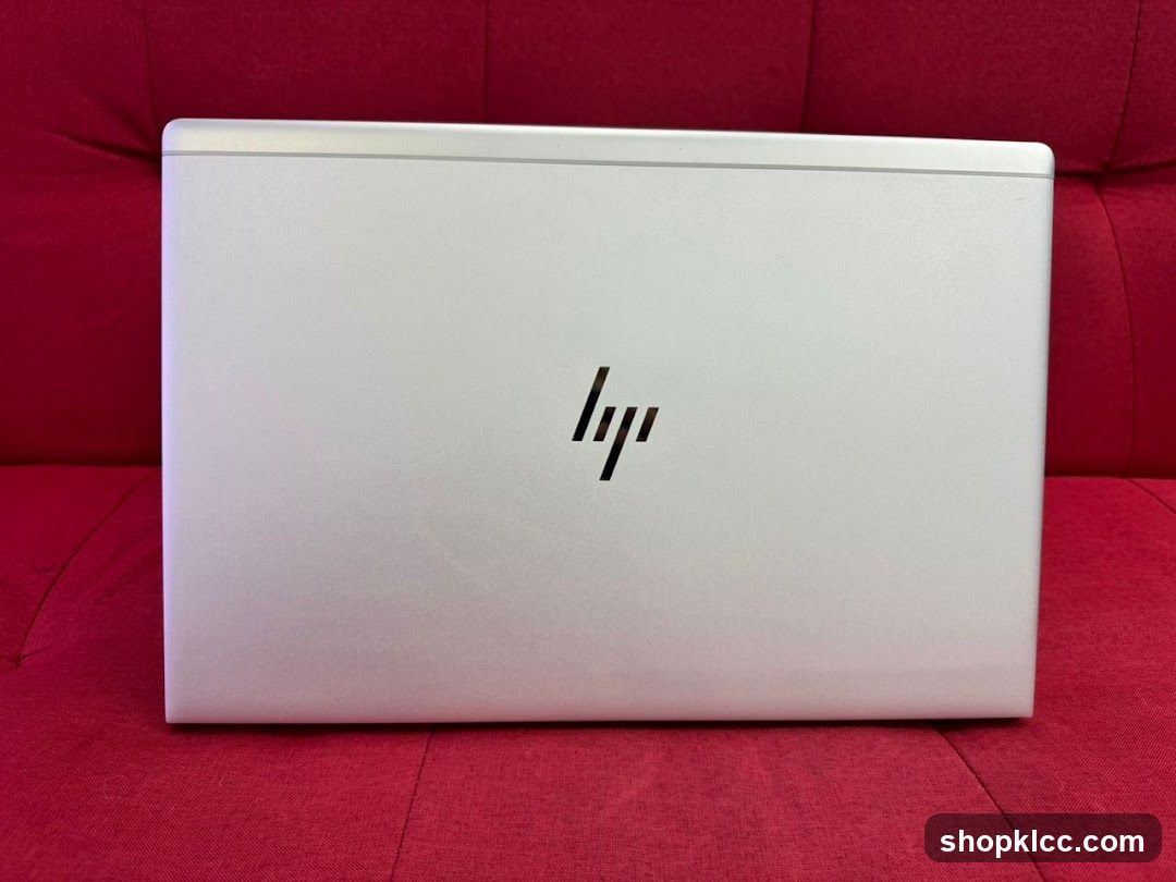 HP Laptop on Red Background
