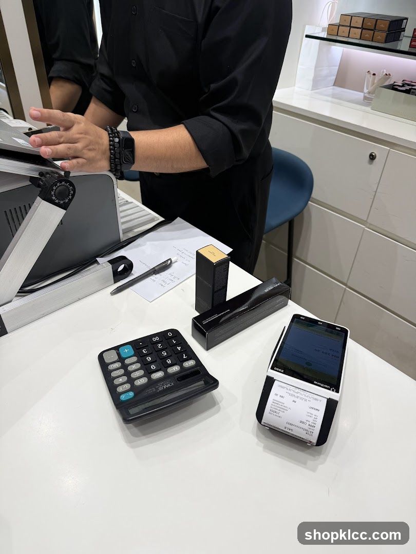 Checkout Counter with POS Terminal and Calculator