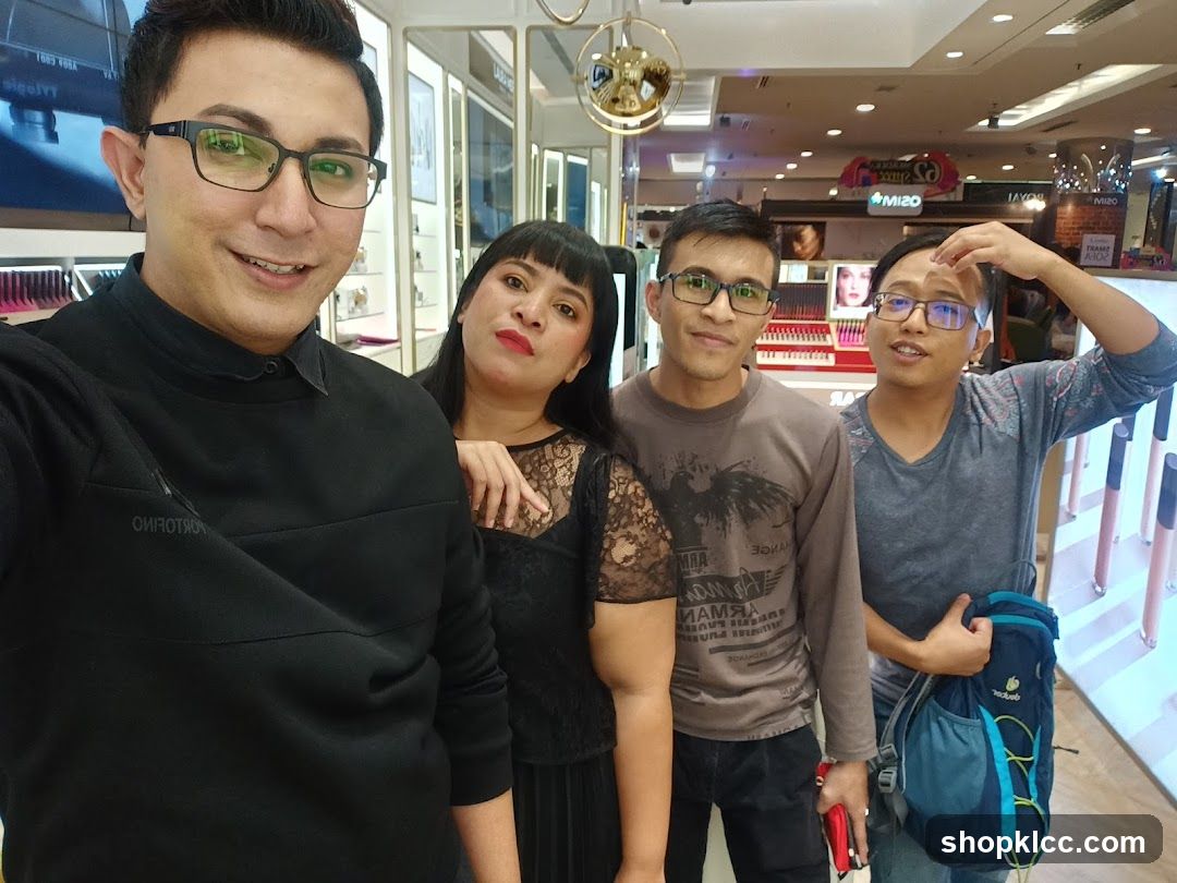 Group selfie in cosmetics store