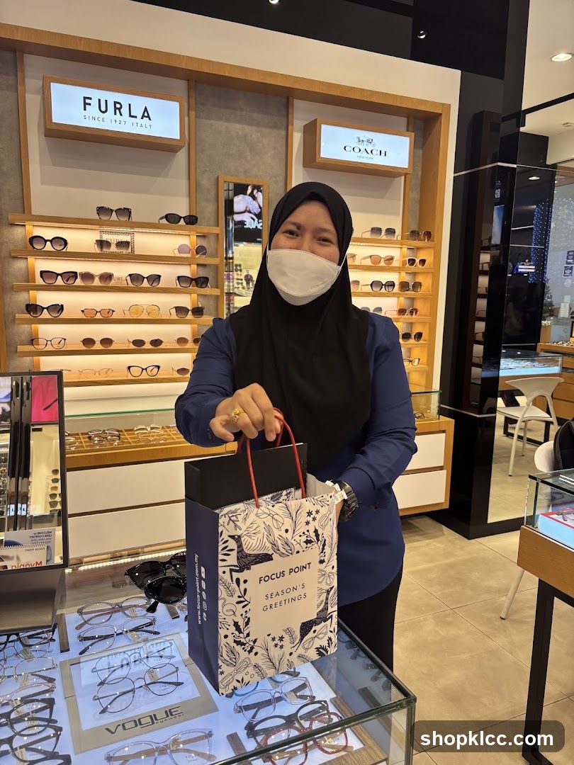 Eyewear Store Interior with Staff Holding Gift Bag
